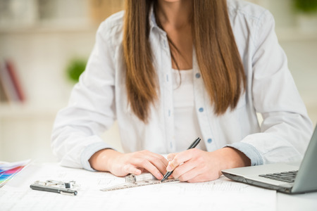 Interior designer working with illustration sketch at modern home office.の写真素材