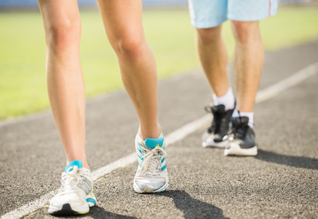 Closeup of sporty couple have training outdoors in the morning.