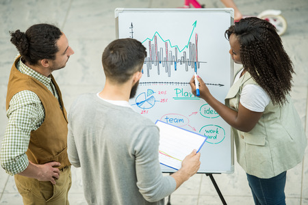 Group of creative young people discuss important project together.の写真素材