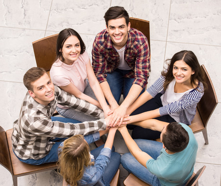 Circle of trust. Group of people sitting in circle and supporting each other.の写真素材