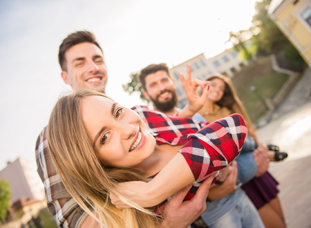 Young people walking outdoors. Sitting in the parkの写真素材