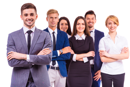 A group of young business people smiling on a white background. Studio shootingの写真素材