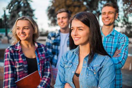 Funny young students, organized a fun time for a walk in the parkの写真素材