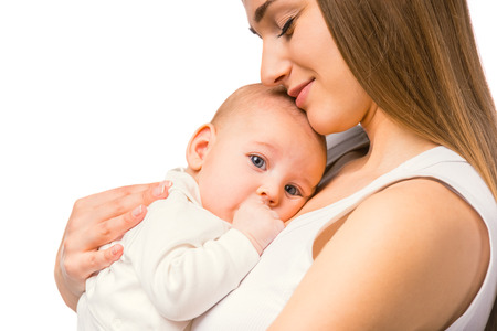 Portrait of happy mother and baby at homeの写真素材