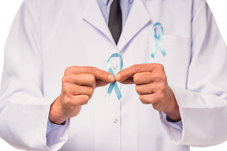 The social problem of male diseases. Portrait of a doctor with a blue ribbon. Isolated on a white...