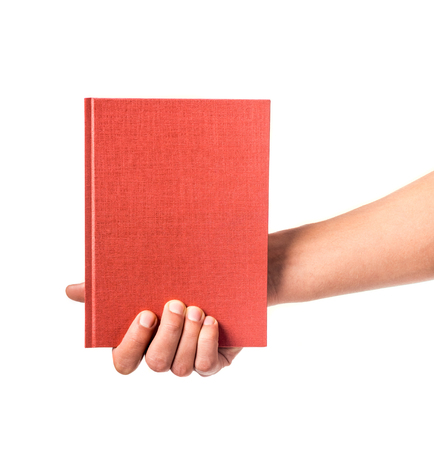 Male hand holding a book isolated on a white backgroundの写真素材