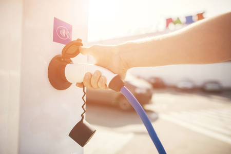 The electric machine stopped at the charging station to recharge.の写真素材