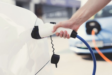 The electric machine stopped at the charging station to recharge.