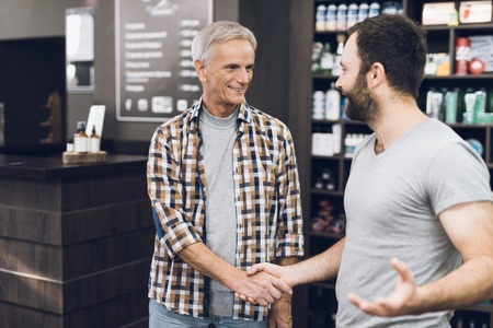 The men greet each other and shake hands.の写真素材