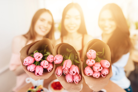 Three girls celebrate the holiday on March 8.の写真素材