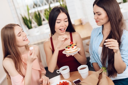 Three girls celebrate the holiday on March 8.の写真素材