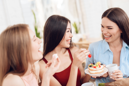 Three girls celebrate the holiday on March 8.の写真素材