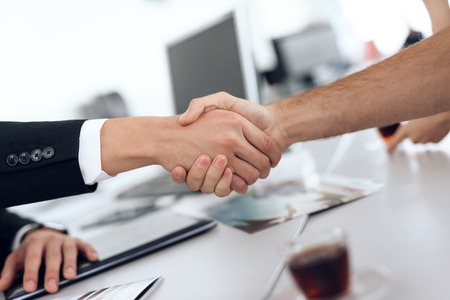 Two men shake hands, making a deal.の写真素材