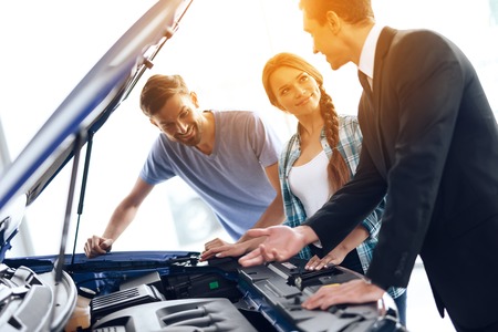 A young family came to the car showroom to choose a new car.