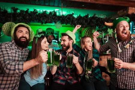 The company of young people celebrate St. Patricks Day.の写真素材