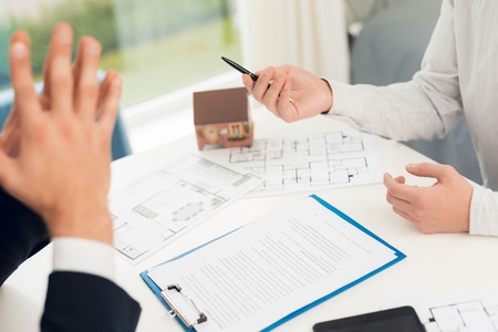 Conclusion of a contract for the purchase of real estate with a realtor. Close-up photo of contract...