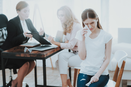 Mother and Young Daughter in Psychologist Office. Visit to Doctor. Conflict in Family. Parent and Child. Unhappy Woman. Communication Concept. Relationship Concept. Psychotherapy Concept.の写真素材