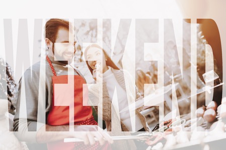 Caucasian Man Talks With Friends On Barbeque. Smiling Friends Are Drinking Wine. Resting Together. Smoked Food. Sweater Weather. Outside Relaxing Activity Concept. Holiday Company Meeting.の写真素材