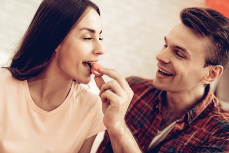 Guy Feeds Girlfriend With Sweet. Valentine's Day. Love Each Other. Sweetheart's Holiday Concept. Feelings Showing. Celebrating Date. Young And Handsome. Beautiful Relationship. Happy Together.の写真素材