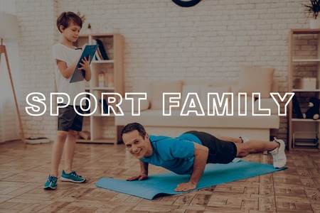Smiling Father Is Doing Push Ups. Sport Family. Healthy Lifestyle. Active Holiday. Exercises...
