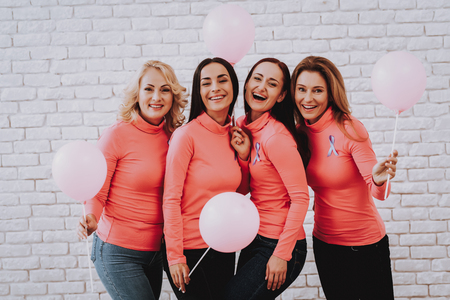 Woman Heppy with People why Fight with Cancer. Help People with Ailment. Model with Ball in Studio. Fight with Family. Lifestyle and Happy Day Together. Girl and Ball. Ball Symbol Smile and Happy.の写真素材