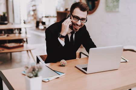 Business Suit. Talking on Phone. Project. Laptop. Sit. Brainstorm. Young Guy. Businessman. Work....