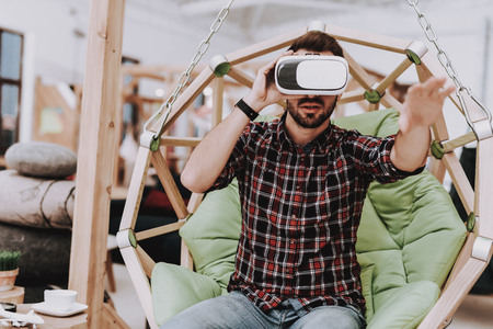 Relaxation. Virtual Reality Glasses. Create Ideas. Inspiration. Creative Worker. Hanging Chair. Sit....