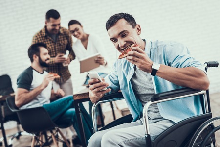 Young People Have Lunch with Pizza in Office. Teamwork in Office. Young Worker. Sitting Man. Box...