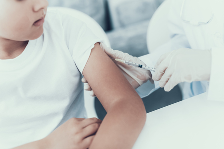 Doctor Visiting Family for Injecting Insulin. Diabetes Concept. Sugar in Blood. Healthcare Concept. Young Woman in Uniform. White Coat. Medical Equipment. Glucometer in Hand. Medical Mask.の写真素材