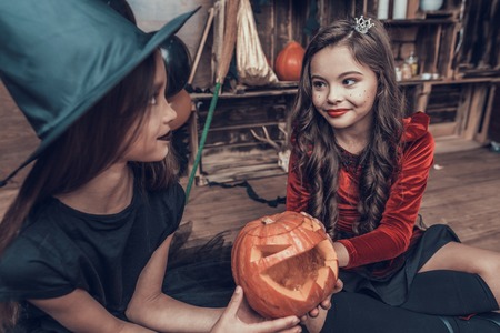 Adorable Little Children in Halloween Costumes.Cute Smiling Kids wearing Scary Halloween Costumes...