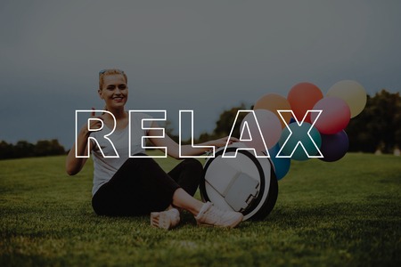 Thumbs Up. Inflatable Balls. Relaxation. Female. Road. Happy. Country Park. Pair. Riding. Gyroboard. Monocle. Love Story. Happy Together. Park. Smiling People. Have Fun. Young People.の写真素材