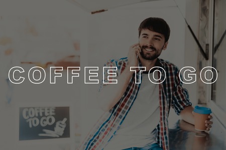 Smiling Young Man In A Plaid Shirt Talking On The Phone. Invitational Namelate. Coffee To Go. Black...