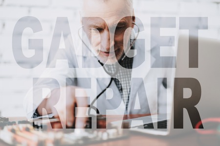 Engineer is Listening Mainboard with Stethoscope.の写真素材