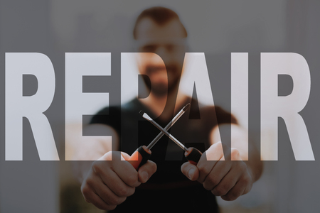 Happy Technician Masters Crossed Screwdrivers.の写真素材