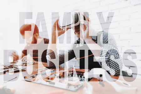 Computer Repairman Fixes VR Glasses, Man Wears Virtual Reality Glasses and Makes Diagnostic.の写真素材