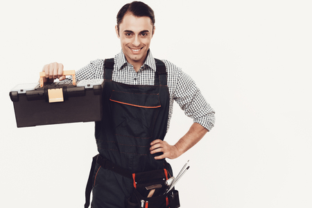 Master in Blue Uniform. Man with Work Tools. Arab Master on White Background. Cheerful Worker....