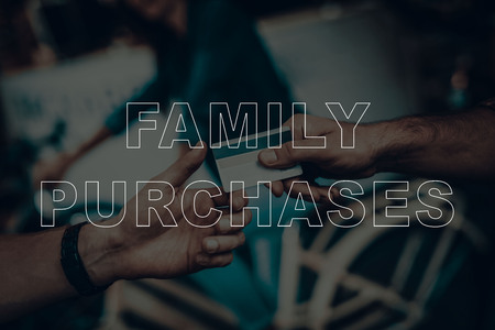 Family Purchases. Customer Buying a Bicycle. Man Giving a Pay to Salesman. Salesman Take a Pay. Pay is the Credit card. Bicycle Shop. Hipster Beard Salesman. Closeup Hands View. Girl on Background.の写真素材