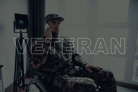 Military Veteran. Disabled Man in a Wheelchair. Man Sits in Front of Window. Man is Soldier. Soldier...