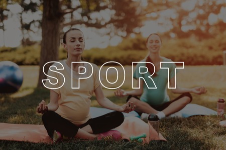 Girls on Yoga Mats. Sport Exercise on Nature. Fitness for Belly Outdoors. Belly Girls Relax. Lotus Position. Pregnancy Yoga. Smiling Pregnant. Bodycare Crossfit. Healthy Lifestyle.の写真素材