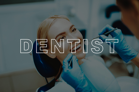 Dental Clinic. Dentist use Dental Equipment. Blue Gloves. Patient Visit Stomatology. Dentist Examine Teeth. Woman Sit in Dental Chair. Smiling Girl. Dentist Instruments. Oral Care. Tooth Healthcare.の写真素材