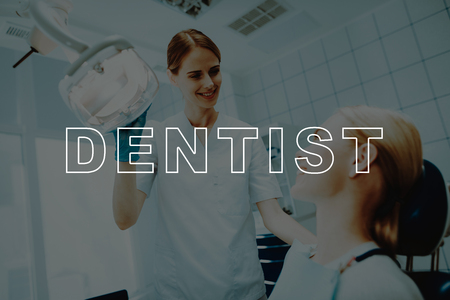 Dentist Examine Teeth. Dentist's Reception. Doctor with Blue Gloves. Nurse Sends a Lamp. Dental Clinic. Tooth Healthcare. Female Visit Stomatology. Smiling Doctor. Girl in Dental Chair. Oral Care .の写真素材