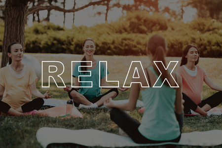 Belly Girls Relax. Lotus Position. Exercise on Nature. Pregnancy Yoga. Pregnant Girls Have Fun. Smiling Pregnant. Girls and Yoga Mats. Fitness for Belly Outdoors. Bodycare Crossfit. Healthy Lifestyle.の写真素材