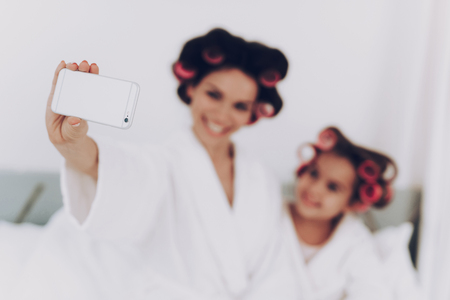 Happiness Girl and Happy Time Together. Happy Life Together with Mother in the Beauty Saloon. People in Beauty Saloon do Selfie Together. Fun Girl and Happy Time Together. Cosmetic and Happy Girl.の写真素材