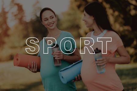 Women with Yoga Mats. Girls Hold Sports Bottle. Smiling Pregnant. Belly Female Walk in Park. Bodycare Crossfit. Healthy Lifestyle. Exercise on Nature. Pregnant in Sportswear. Fitness for Belly.の写真素材