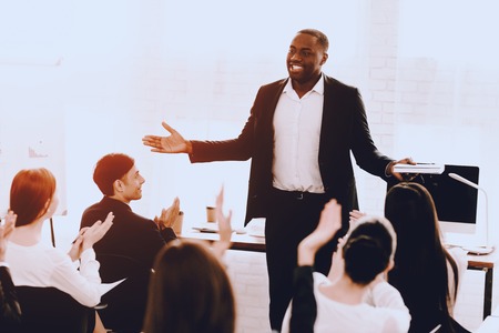 Team of Managers on Business Meeting in Office. Training in Office. Modern Office Concept. Cooperation with Colleagues. Businessman with Team. Team Building on Workplace. Businessman in Suit.の写真素材