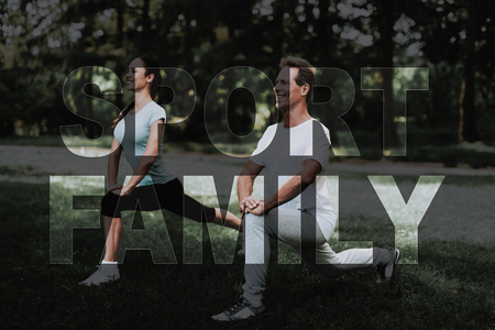 Smiling Sport Family. Couple Doing Exercises in Park. Group of People Doing Flexibility Exercises. Sport Family in Park. Family Warm Up Outdoor. Guys Leads Healthy Lifestyle. Guys in Light Sportswear.の写真素材