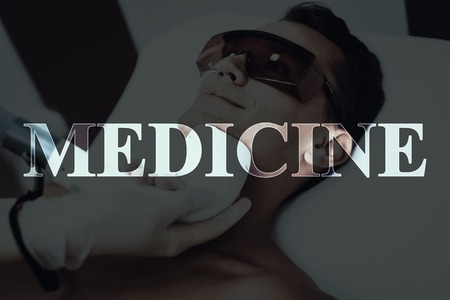 Young Man In The Beauty Salon. Epilation Medicine. Hair Removal. Laying On Couch. Preparing For The Procedure. Modern Spa Salon. Body Chest Cleaning. Naked Patient. Protective Glasses.の写真素材