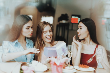 Freshness and Young Girls Celebrate 8 March Together. Bouquet and Good Champagne. Lifestyle fwith Friend. Celebrate 8 March Together. Friends Smiling in Springtime. Tulip Bouquet for all Happy Girls.の写真素材