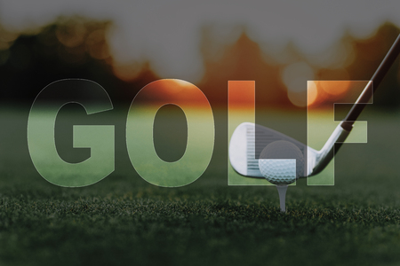 Golf Ball on a Tee. Golf Club near the Ball. Player about to Take Shot. Green Grass, Turf of a Golf Course. Professional Sports Equipment. Fresh Summer Lawn. Luxury Active Recreation. Elite Sports.の写真素材
