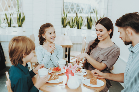 Good Family in Day 8 March. Happiness Girl in Day 8 March. Holiday with Family Celebrate Day 8 March. Springtime in Happy Family. Tea and Good Fod in Day 8 March. Woman and Girl Celebrate 8 March.の写真素材
